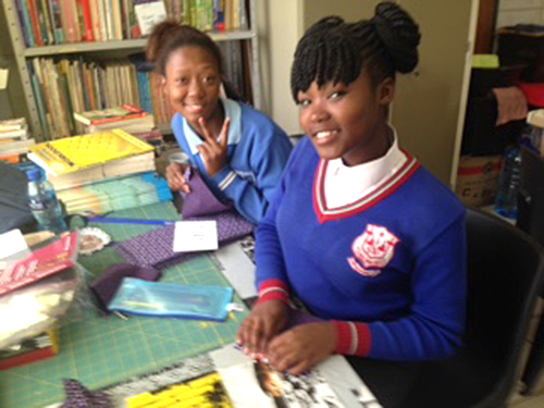 Kwa Guqa girls helping with order